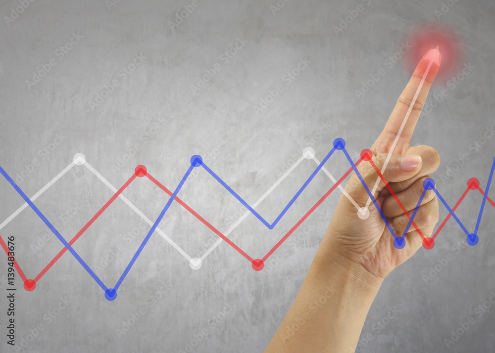 Finger of Businessman touch line graph business in peak point. Finger of Businessman touch line graph business in peak point.