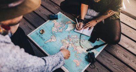 Tourist Planning vacation using world map.