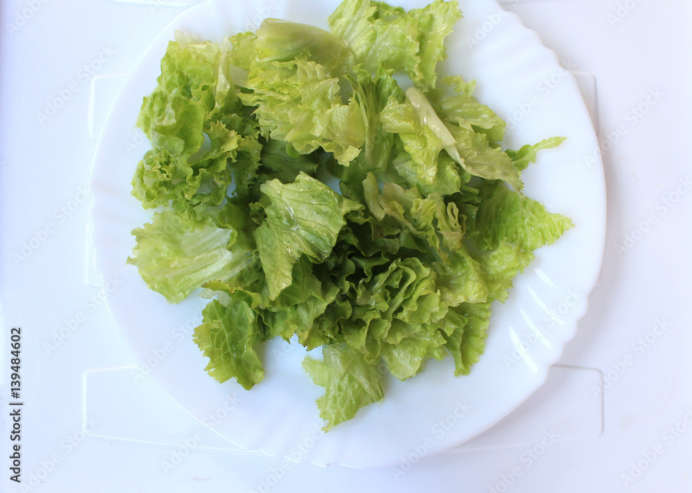 Salad of vegetables and greens with grains on a plate
Salad of vegetables and greens with grains on a plate