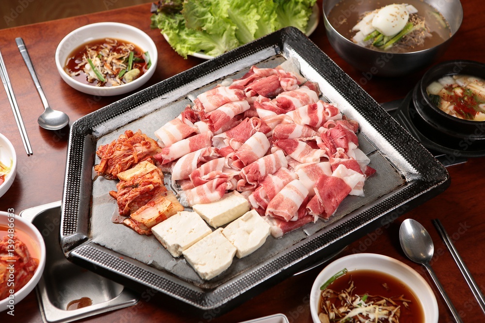 grilled beef brisket. It's a korean style table. grilled beef brisket. It's a korean style table.