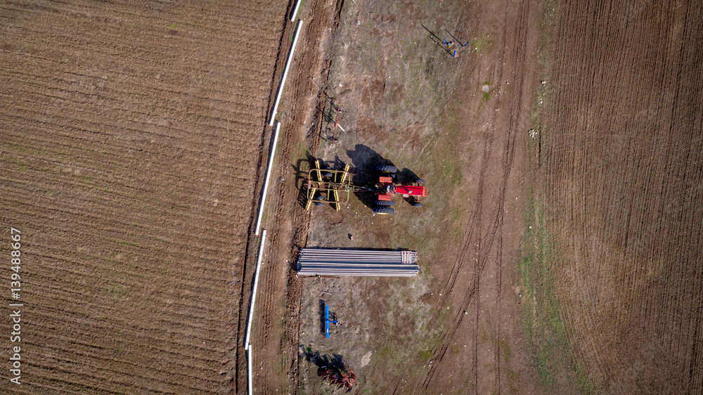 View from above of an old tractor and farm field View from above of an old tractor and farm field