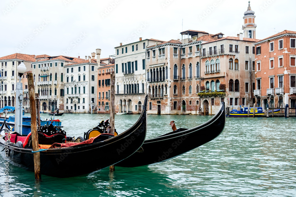 Docked gondolas on the Grand Canal, in Venice, Italy