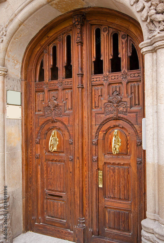 Carved wooden doors found in Barcelona, Spain.