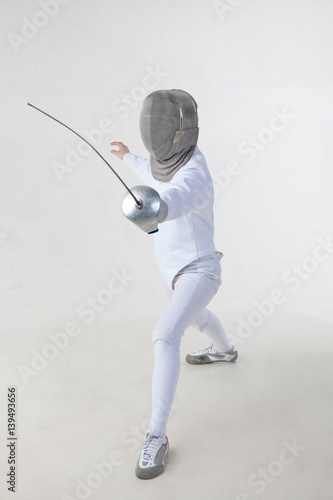 Female fencer isolated on white background