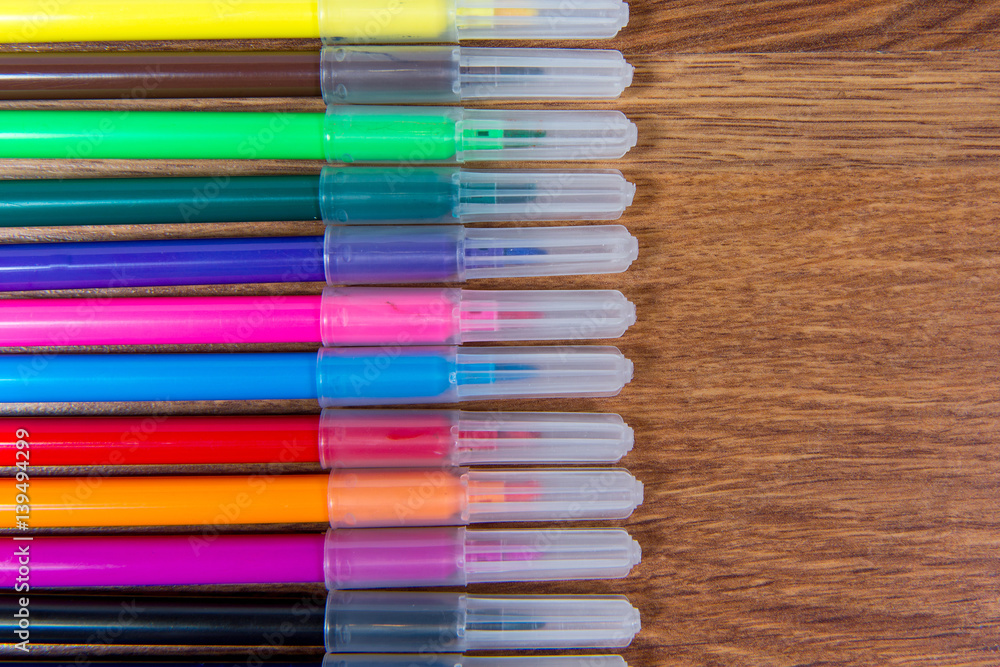 Fototapeta premium Multicolored flomatsery close-up laid out on the table. Stationery.
