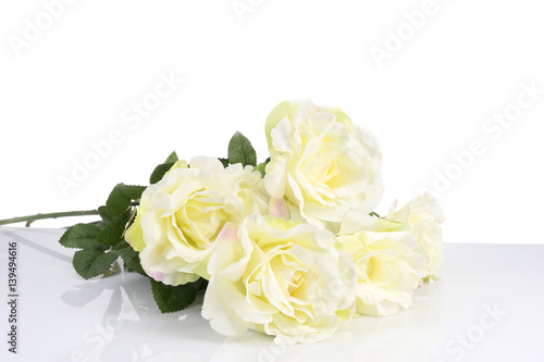 White roses on glass table