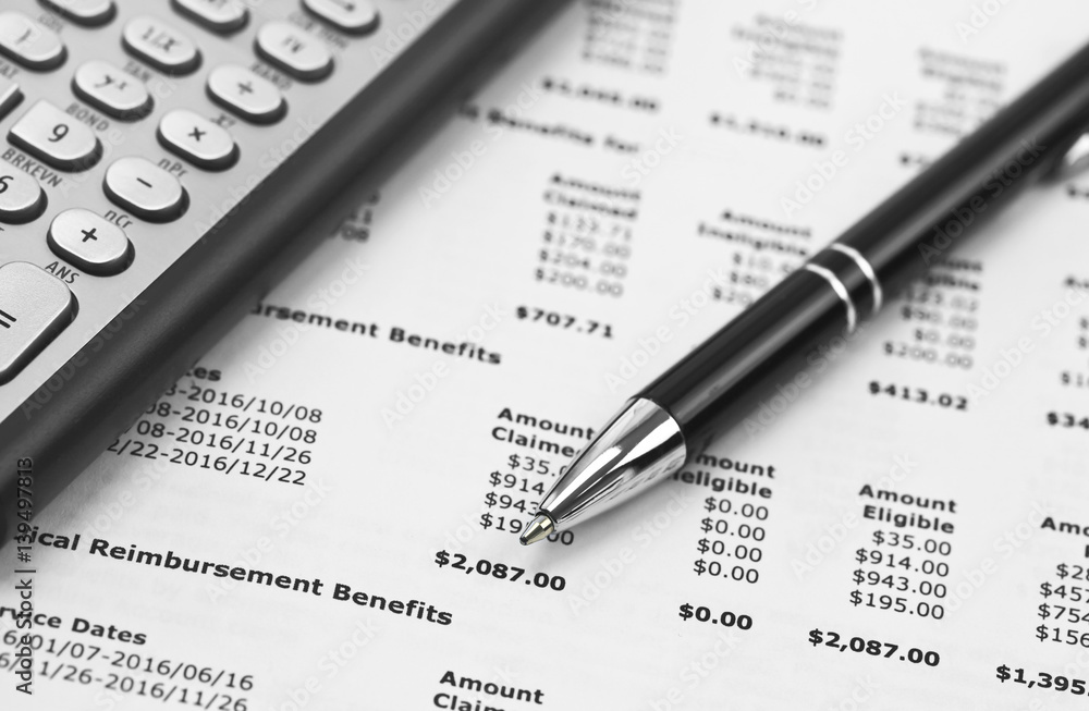 Pen and calculator on the Financial document Pen and calculator on the Financial document