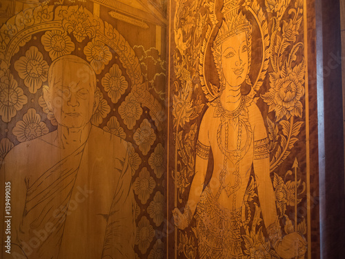 An ancient mural wood carving in Thai temple