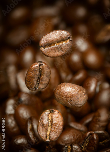 Macro photo of flying coffee beans. All beans in focus.