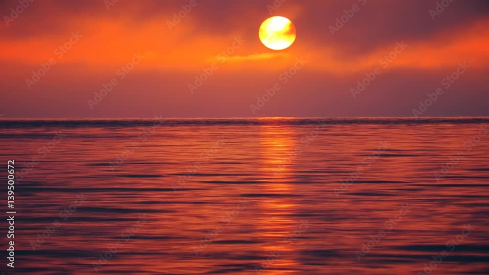 Time lapse. Sunset. Red sky and sun over the sea. Time lapse. Sunset. Red sky and sun over the sea.