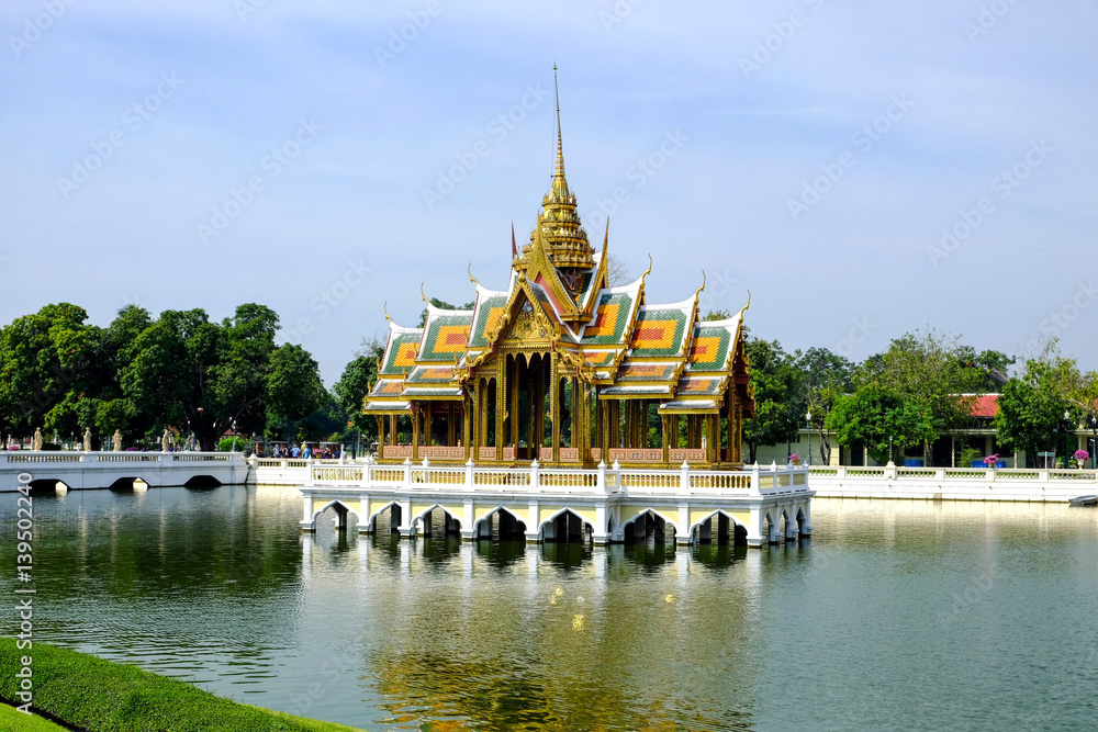 PHRA THINANG (Royal Residence) AISAWAN THIPHYA-ART, is a Thai-style pavilion four porches and a spired roof built by king chulalongkorn, Bang Pa-In Palace, Ayutthaya Province, Thailand PHRA THINANG (Royal Residence) AISAWAN THIPHYA-ART, is a Thai-style pavilion four porches and a spired roof built by king chulalongkorn, Bang Pa-In Palace, Ayutthaya Province, Thailand