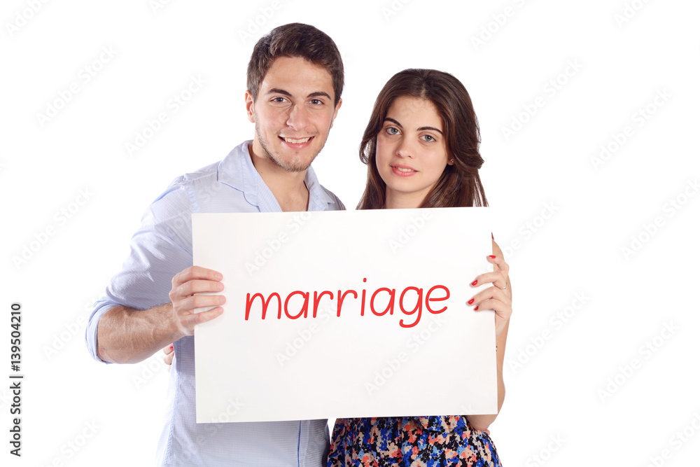 Couple holding cardboard with word Couple holding cardboard with word