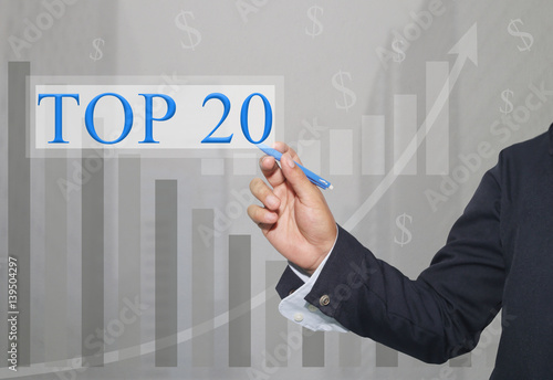 Hand of businessman Write a text of TOP20. photo