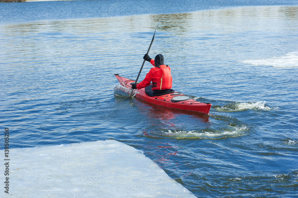 man kayaking on a red kayak on excursions in nature 08