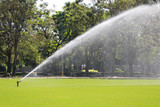 Sprinkler in Watering green lawn of golf courses.