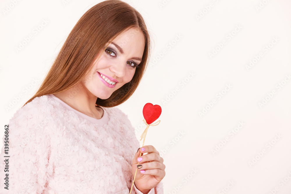 Beautiful woman holding heart shaped hand stick Beautiful woman holding heart shaped hand stick