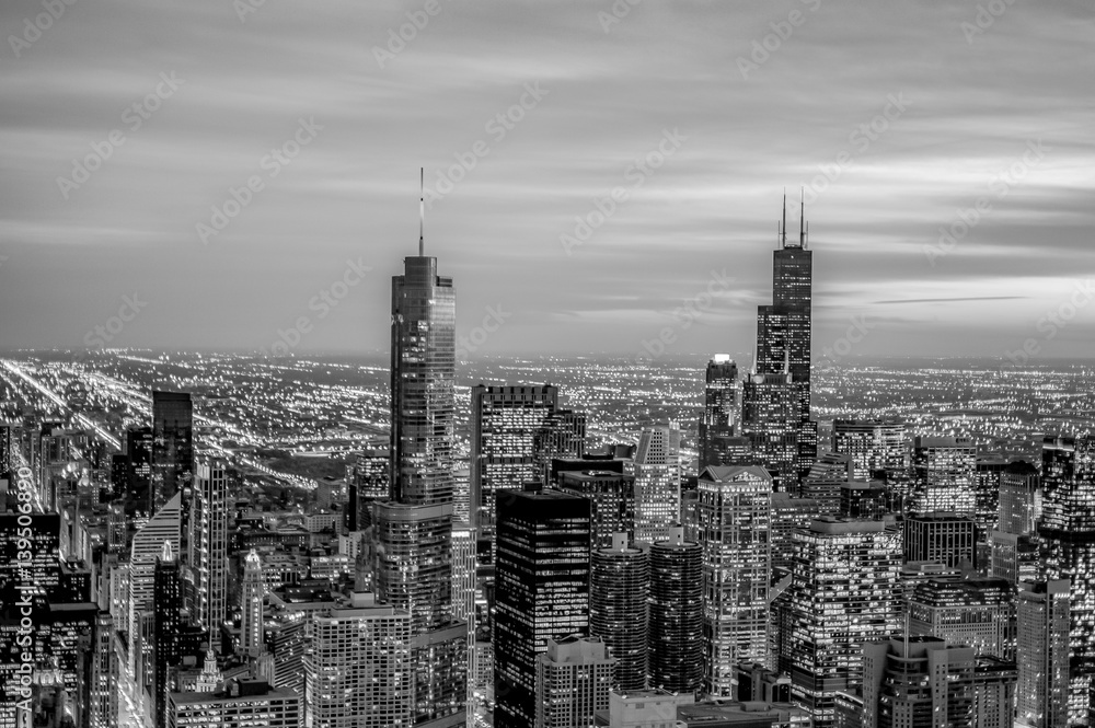 Fototapeta premium view of the Chicago city at night with skyscrapers lit