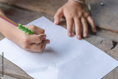 Hand children writing with pencil