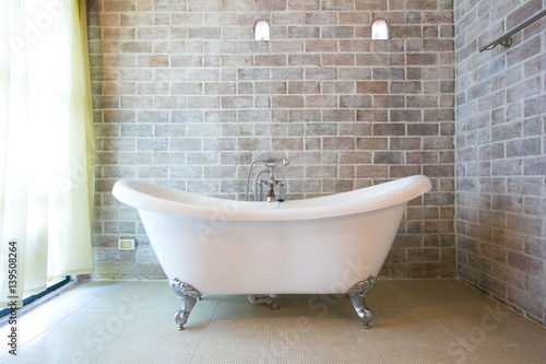 Beautiful luxury vintage bathtub decoration in bathroom interior - Vintage filter photo