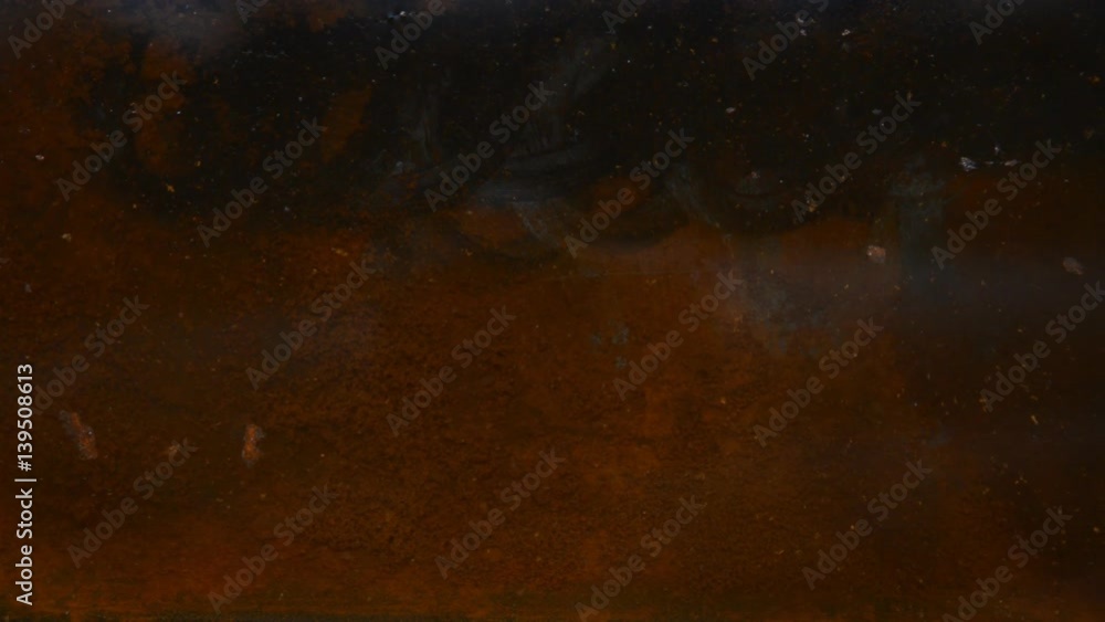 Rusty sheet of metal in the water. Rusty sheet of metal in the water.