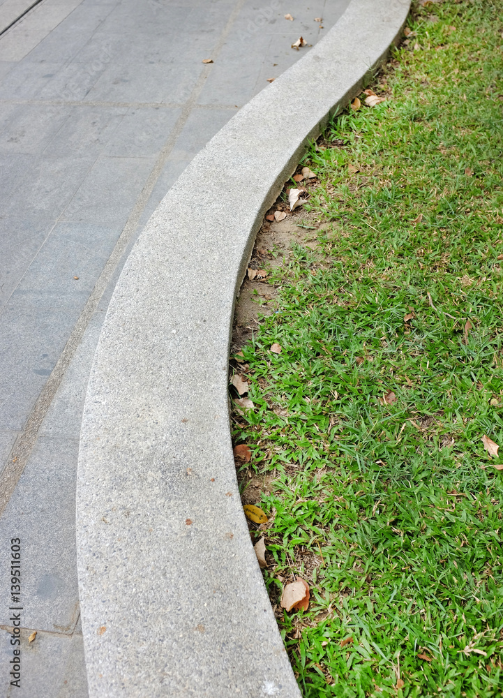 long cement bench in the public park