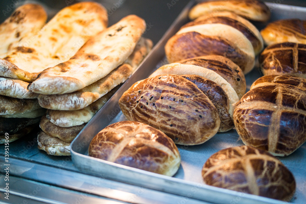 Turkish Pastries Pogaca and Pide at patisserie showcase. Turkish Pastries Pogaca and Pide at patisserie showcase.