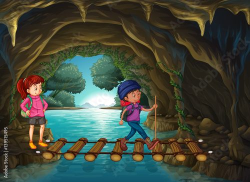 Two tourists walking in the cave