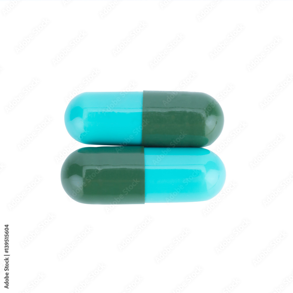 Two capsule color green and blue isolated on white background Two capsule color green and blue isolated on white background