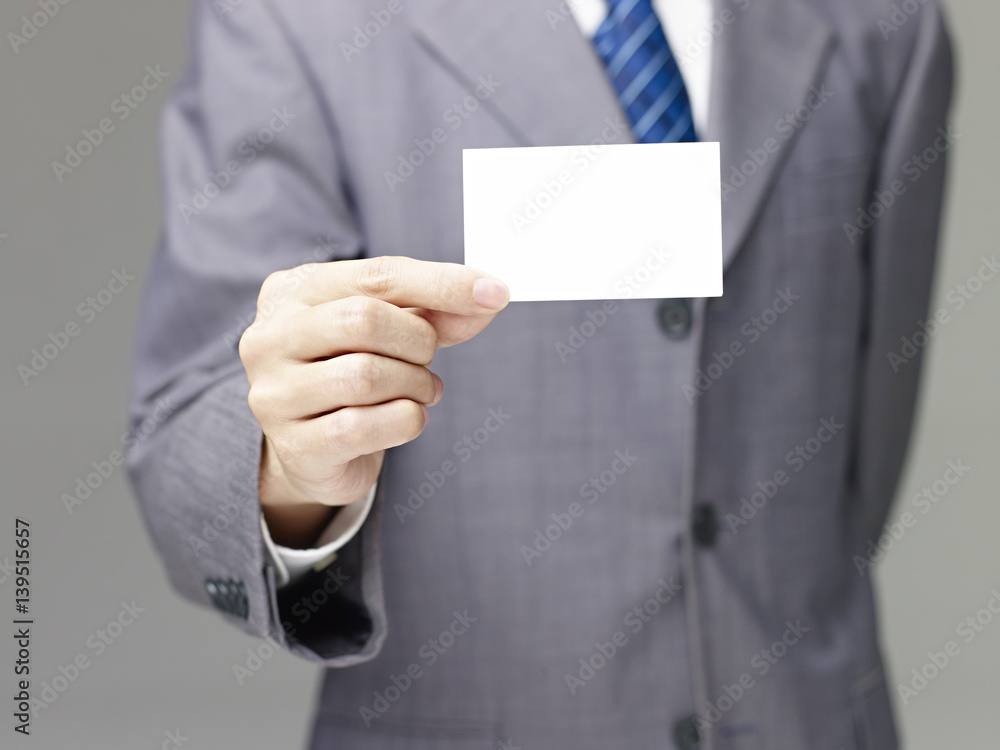business person holding a blank name card business person holding a blank name card