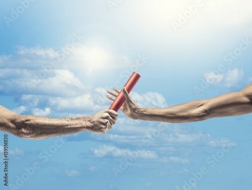Obraz na plátne Handing off the baton in a track and field event