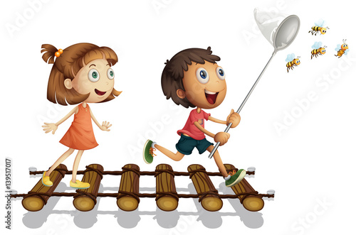 Two kids catching bee with net