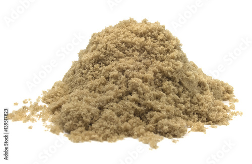 Isolated brown sugar on a white background.
