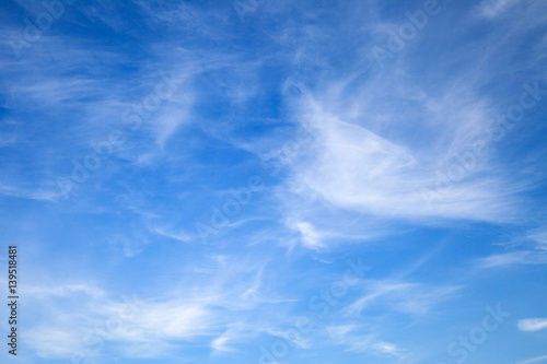 Light cirrus clouds on blue sky, background photo