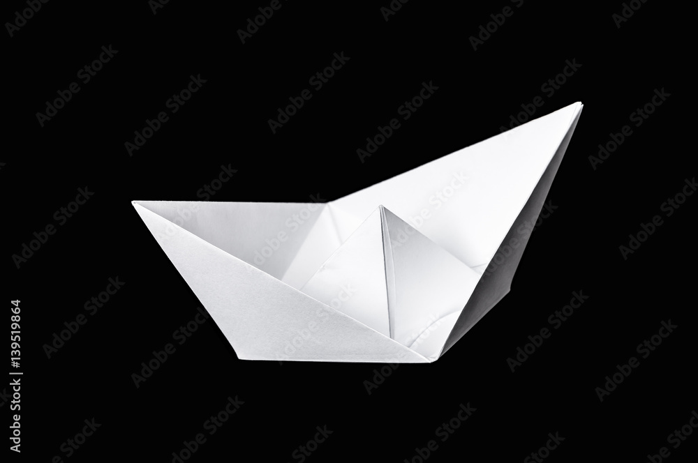 Origami boat isolated on black background Origami boat isolated on black background