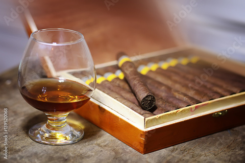 Photos Large box of Cuban cigars on a wooden table
