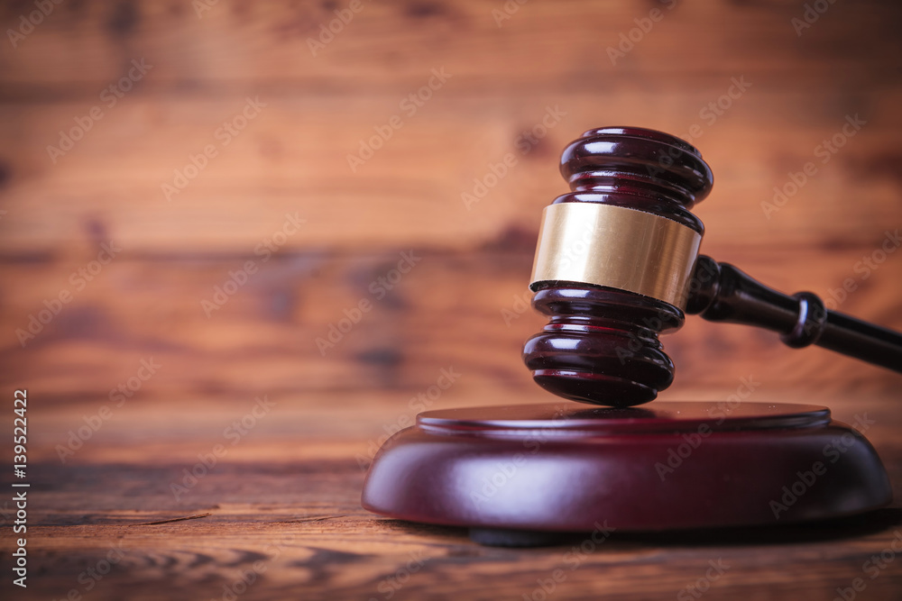 judge's hammer on wooden background judge's hammer on wooden background