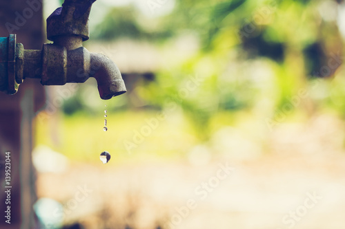 water drop from tap,Leaking water
