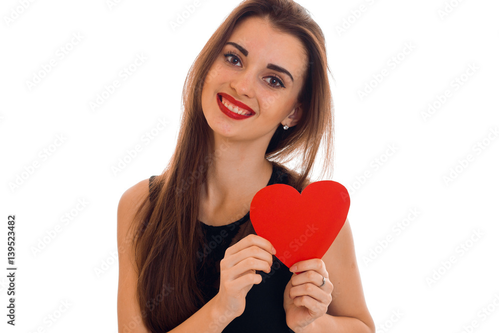 happy young brunette woman with red lips and heart in her hands posing isolated on white background happy young brunette woman with red lips and heart in her hands posing isolated on white background