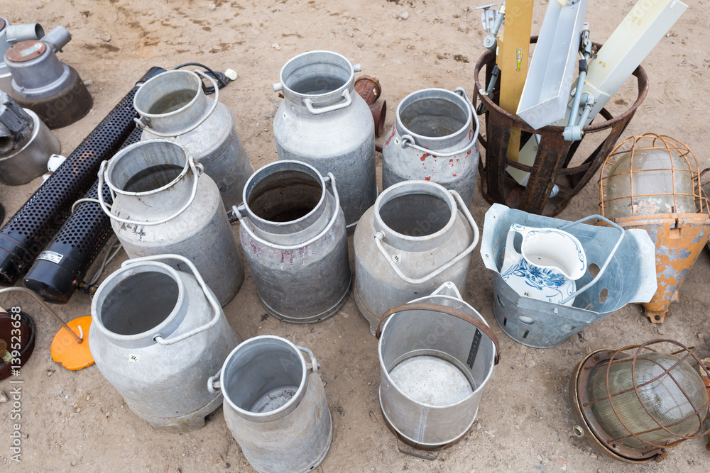 Different Used Water Cans on Flea Market Different Used Water Cans on Flea Market