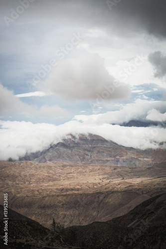 Clouds on top of the Andes mountains. Summer weather in the Peruvian Andes, south of Arequipa. Vertical image.