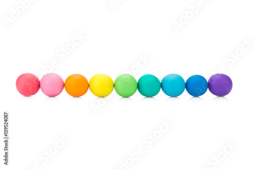 plasticine clay colorful ball rainbow on white background closeup