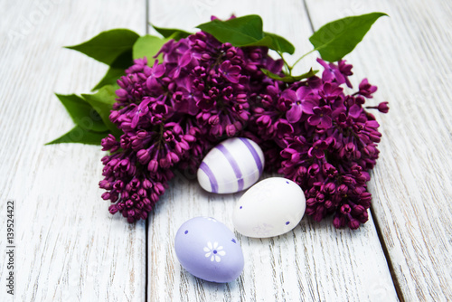 easter eggs and fresh lilac flowers