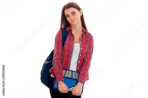 cute young brunette students teenager in stylish clothes and backpack on her shoulders posing isolated on white background