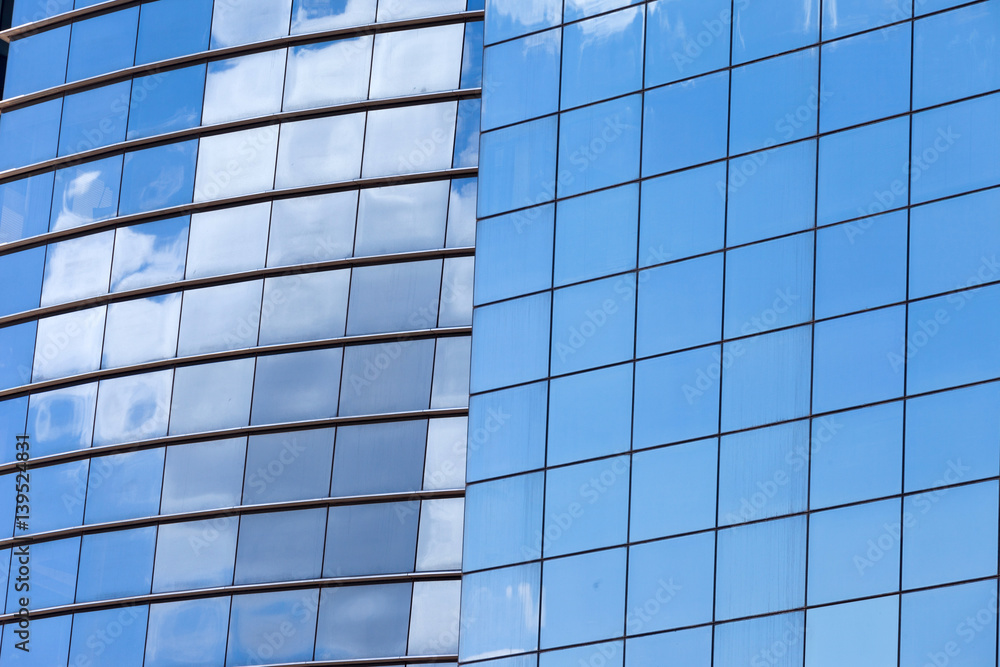 Modern skyscrapers with window reflections of blue sky Modern skyscrapers with window reflections of blue sky