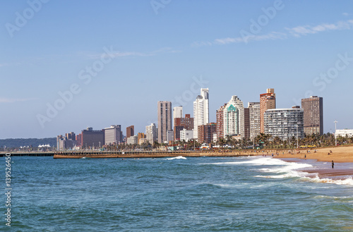 Coastal Landscape Beach Ocean Blue Sky and City Skyline © lcswart