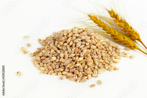 Ears of wheat and bowl of wheat grains