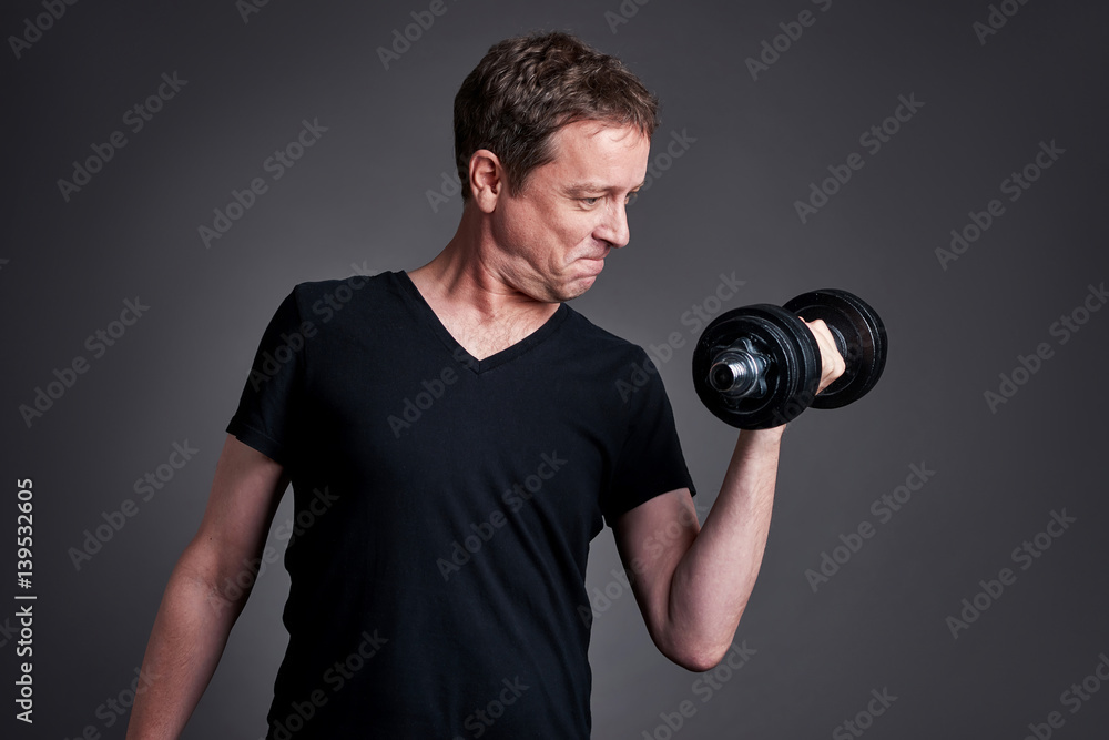 Middle age man with weights Middle age man with weights