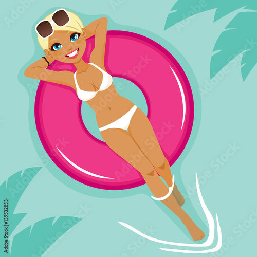 Beautiful young blonde woman sunbathing resting on big pink inflatable float on water