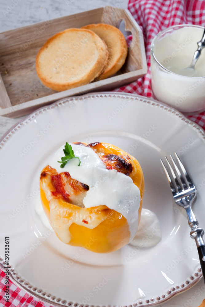 Yellow stuffed pepper with chicken meat dressing with cream