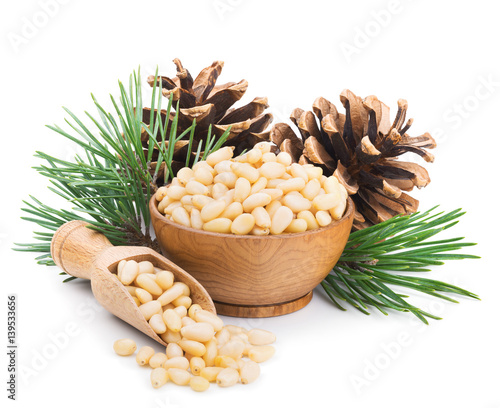 Foto Pine nuts with branches and cones isolated on white